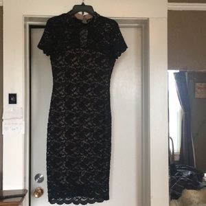 A beautiful lace black dress with a high neck